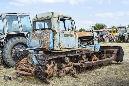 Old rusty disassembled tractor.