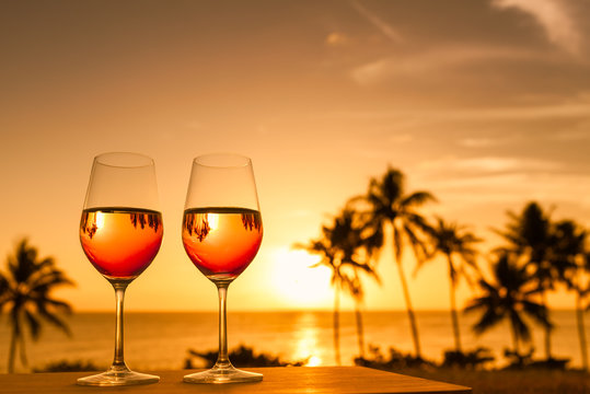 Romantic tropical getaway for two concept. Wine and a beautiful sunset. 