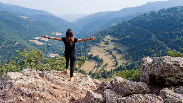 Woman on the top of the mountain