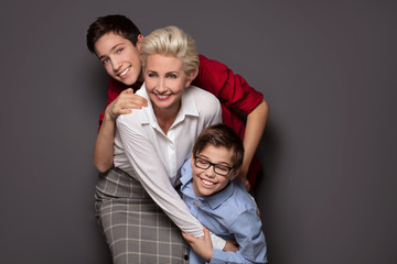 Happy mother posing with two sons.