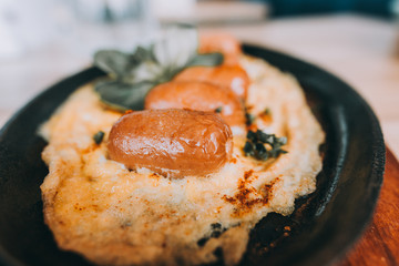 Omelette with chorizo sausage, herbs and tomatoes