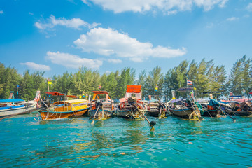 Outdoor view of Fishing thai boats in a row in Po-da island, Krabi Province, Andaman Sea, South of Thailand