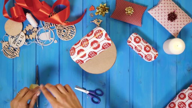 Hands wrapping a gift