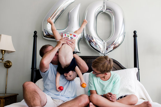 father turns 40 and is celebrating with his two children