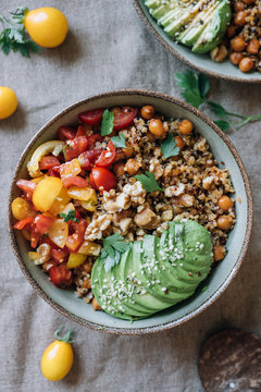Quinoa bowl with roasted chickpeas, cherry tomatoes and avocado