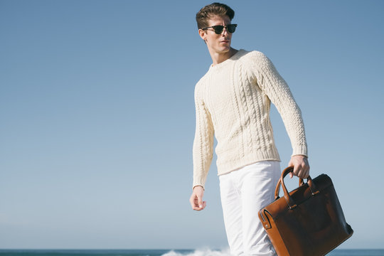 A man walking at the beach