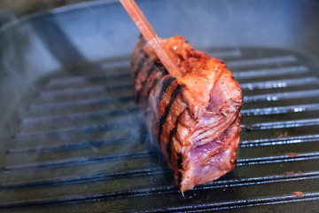 Three steaks roasted on the grill