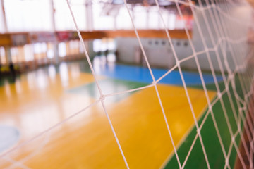 Football defocused gate field, Futsal ball field in the gym indoor, Soccer sport field