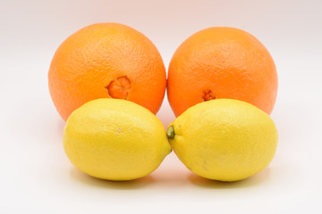 Citrus fruits arranged on a white background. 