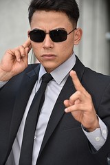 Young Security Guard Pointing Wearing Sunglasses