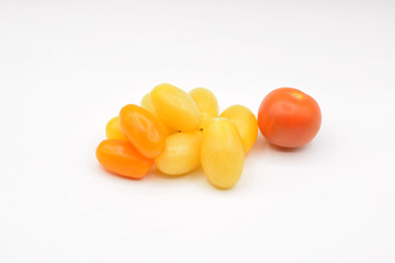 Tiny grape tomatoes in red, orange, yellow, and purple. 