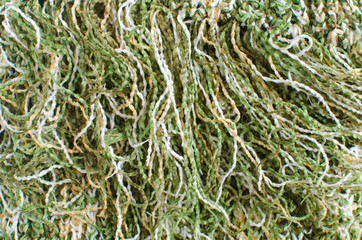 woolen multicolored background of long twisted threads