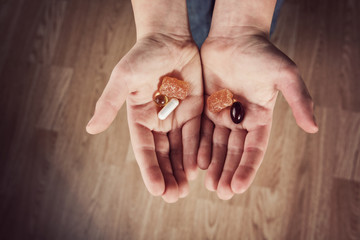 Child holding natural children's vitamins