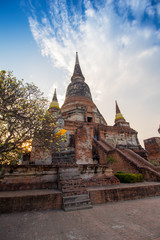 Fototapeta premium The Pagoda and Buddha Status at Wat Yai Chaimongkol, Ayutthaya,