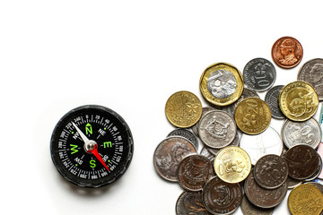 Group of Thai bath and other currency cash money gold and silver coin in financial payment system with different values and black compass on white background