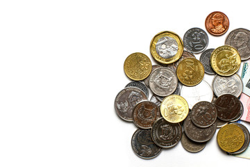 Group of Thai bath and other currency cash money gold and silver coin in financial payment system with different values on white background