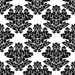 Damask seamless pattern intricate design. Luxury royal ornament, victorian texture for wallpapers, textile, wrapping. Exquisite floral baroque lacy flourish in black and white monochrome colors