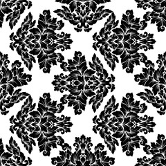 Damask seamless pattern intricate design. Luxury royal ornament, victorian texture for wallpapers, textile, wrapping. Exquisite floral baroque lacy flourish in black and white monochrome colors