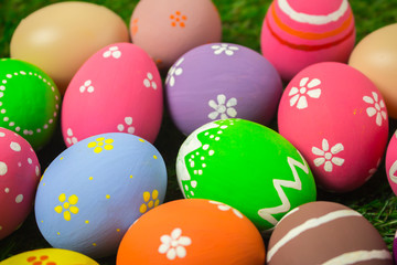 Fototapeta na wymiar Easter eggs on the green grass.