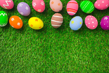 Easter eggs on the green grass.