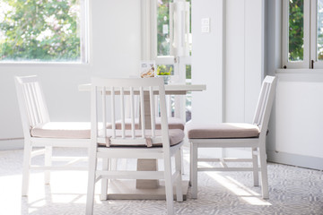 Modern white table and chair set in a cafe