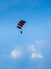 Skydiver with colorful parachute