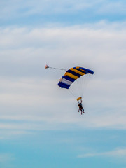 Skydiver with colorful parachute