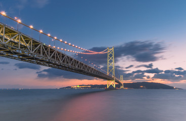 Naklejka premium Akashi Kaikyo Bridge or Pearl Bridge is the world's largest suspension bridge, the largest island in the Seto Inland Sea. The Bridge is communication from Awaji Island to Kobe, Japan.