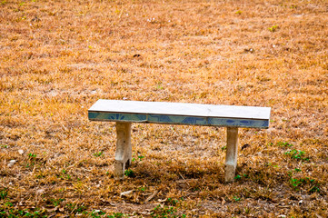 The chair is in the middle of the courtyard.