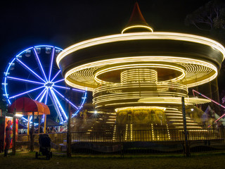 Bright illuminated lights from festival rides