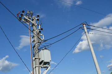 Electric power line poles with transformer and wires