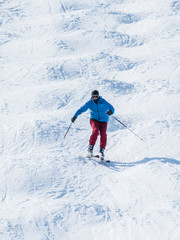 Fototapeta na wymiar People are enjoying mogul skiing snow boarding