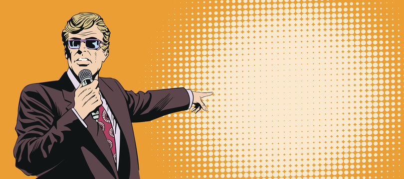 Businessman with microphone points with his finger.