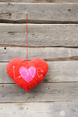 Heart on wooden background. Valentines day concept. Background of planks with space for text.
