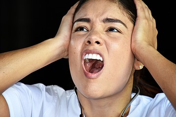 Stressed Beautiful Nurse Wearing Scrubs