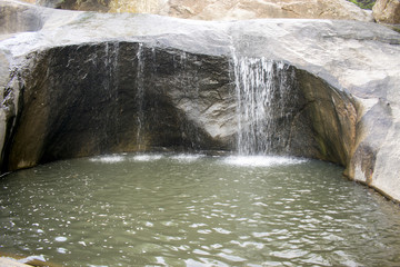 Fototapeta na wymiar Flowing Water from Rocks