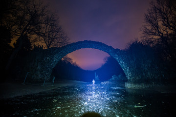 Devil bridge in Kromlau in night.