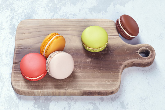 3d render composition with sweet macarons dessert on a wooden cutting board