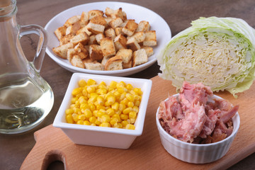 Fresh Chinese cabbage, Sweet canned corn, Delicious crispy croutons and canned tuna. Ingredients for dietary salad.