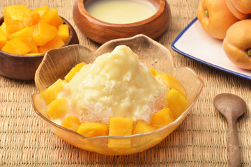 Shaved ice dessert with fresh mango   