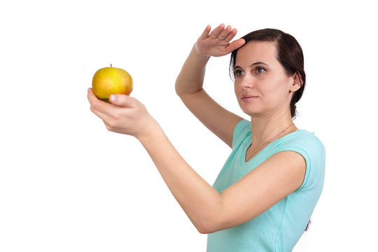 One girl holds before herself apple in hand