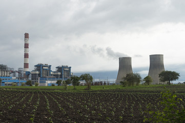 Fototapeta na wymiar Coal based Supercritical Thermal Power Plant in Agricultural Field
