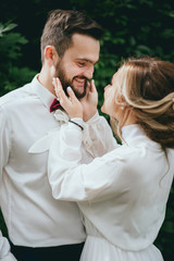 bride and groom walking in a beautiful garden. trees, Park