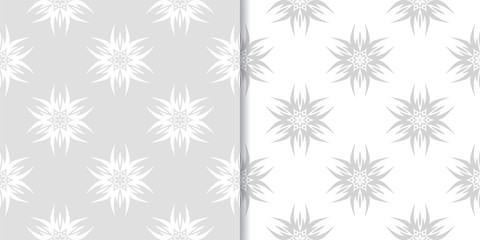 Light gray floral ornaments. Set of seamless patterns