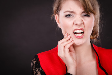 Negative emotion. Woman having tooth ache.
