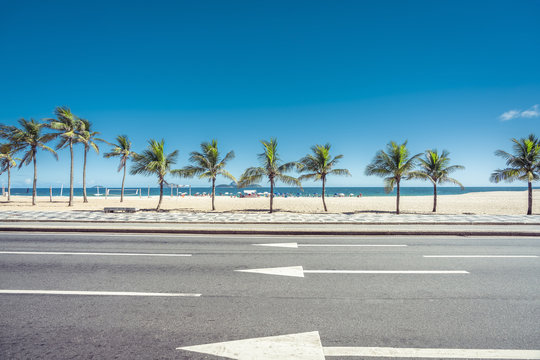 Sunny summer day with Palms on Ipanema Beach,  Rio de Janeiro, Brazil.
