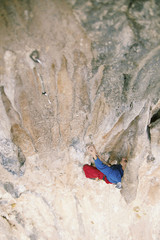 Rock-climbing in Turkey. The guy climbs on the route. Photo from the top.
