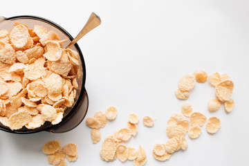 Delicious crispy cornflakes in bowl on white background, healthy breakfast