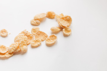 Round frame of delicious crispy cornflakes on white background, healthy breakfast