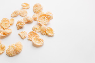 Round frame of delicious crispy cornflakes on white background, healthy breakfast